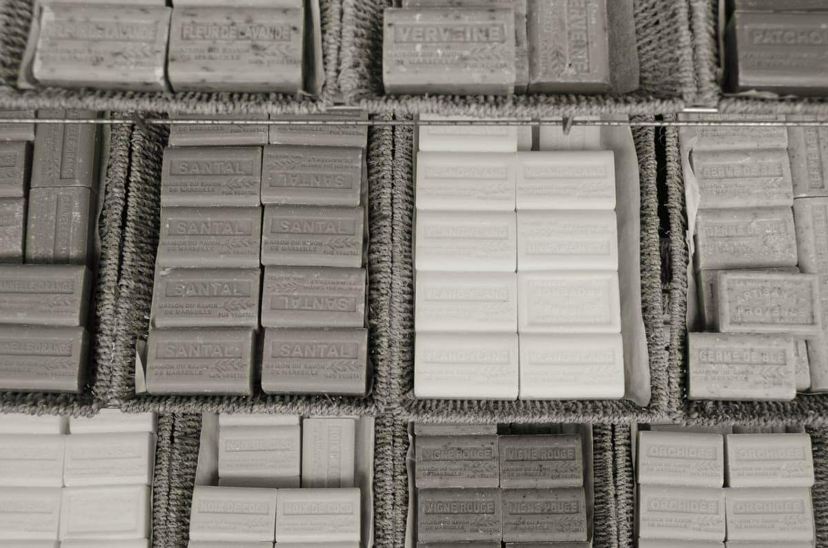 Colorful handmade soap bars arranged on a wooden surface