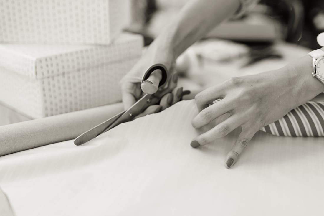 Kraft paper, twine and scissors laid out for wrapping
