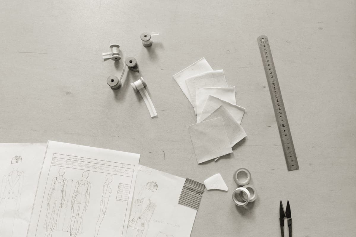 Craft tools and materials laid out on a work surface