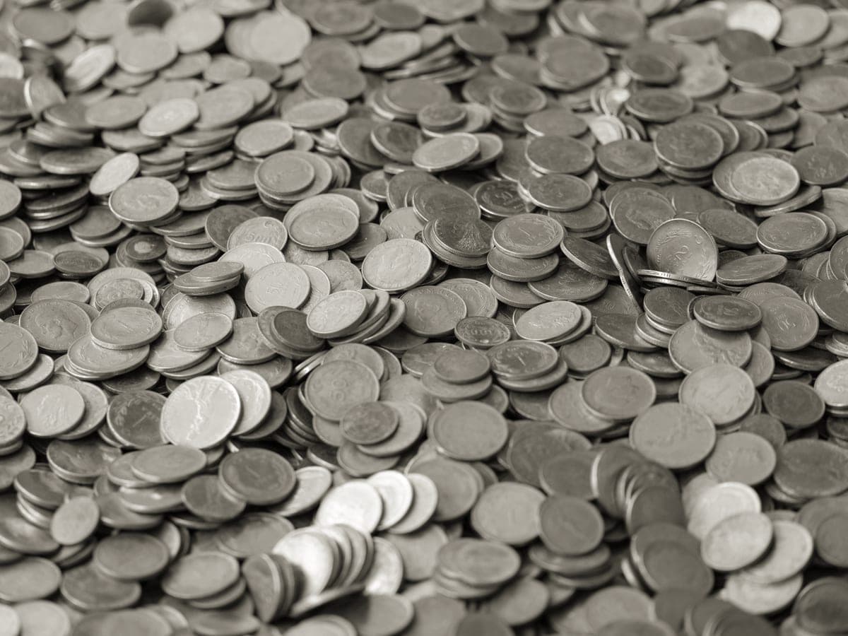 Coins spread across a surface, representing a fixed gift budget